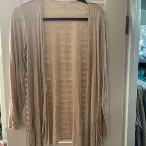 Tan woman’s cardigan